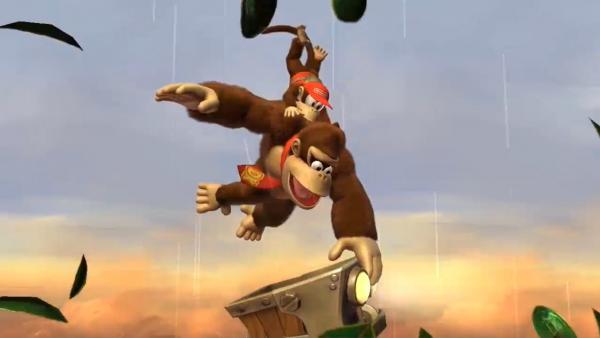 Donkey Kong schwingt mit einem kleinen Affen auf dem Rücken an einer Liane.