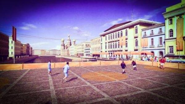 Ein Fußballspiel auf einem Straßenplatz.