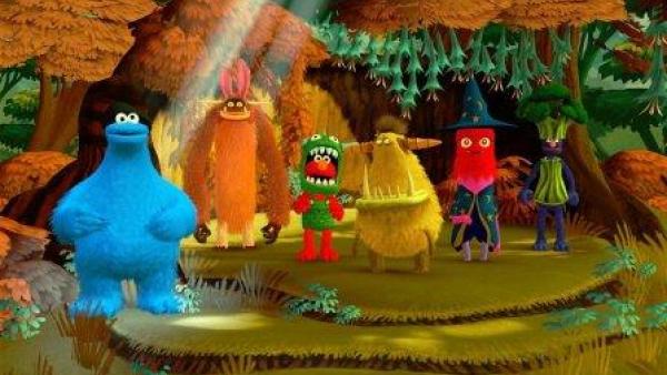 Sechs Figuren der Sesamstraße in bunter, fröhlicher Umgebung.