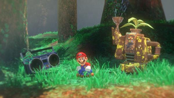 screenshot: Mario steht im Forstland. Neben ihm befindet sich ein Radio und eine Robotergießkanne.