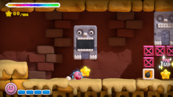 Screenshot: Kirby läuft unter herabfallenden Stein durch