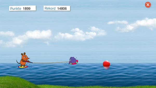 Screenshot: Die Maus lässt sich von "Elefant" über das Wasser ziehen und muss Gegenständen ausweichen