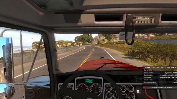 Screenshot: Aus der Fahrerperspektive wird ein LKW entlang eines Strandes gefahren.