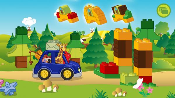 Screenshot: Hase und Giraffe fahren mit einem Auto durch den Wald und müssen ein Tor aus Bauklötzen anfertigen.