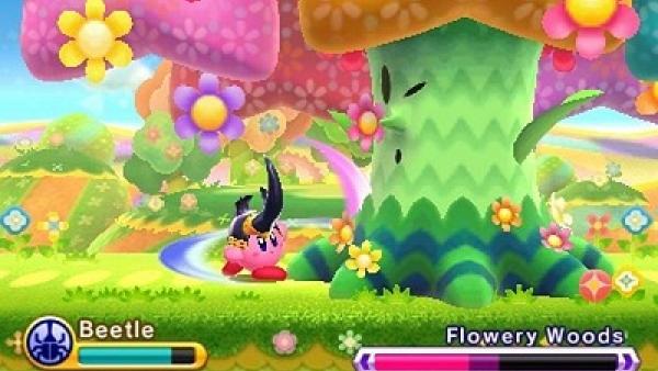 Screenshot von "Kirby: Triple Deluxe" zeigt einen Käfer-Kirby im Kampf gegen einen riesigen Baum