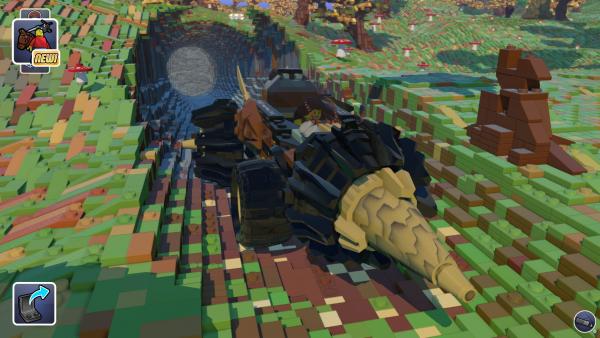 Screenshot: Ein weiblicher LEGO-Charakter steuert einen vierrädrigen Tunnelbohrer aus einem gebohrten Loch in der LEGO-Landschaft