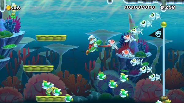 Screenshot: Mario reitet unter Wasser auf dem grünen Dinosaurier Yoshi.