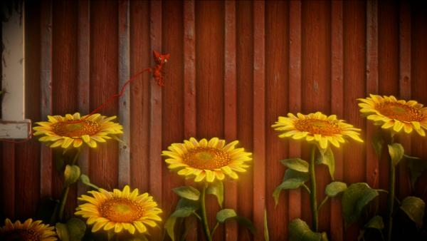 Screenshot: Yarny springt auf eine Sonnenblume