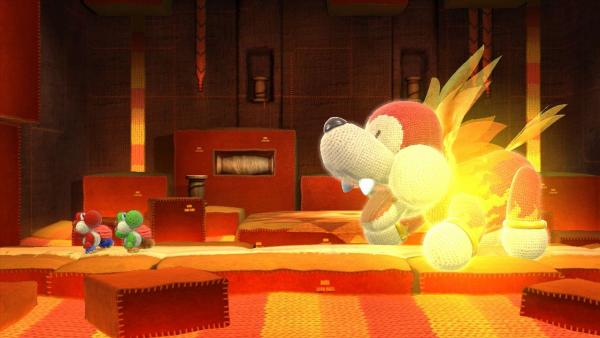 Screenshot: zwei Yoshis kämpfen gegen einen riesigen feuerspeienden Hund